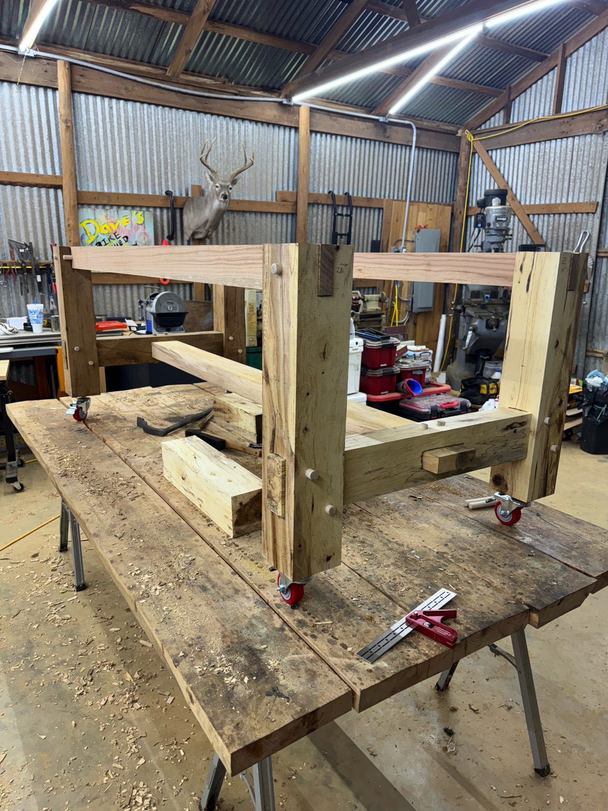 Timber-frame bench base being built in the shop